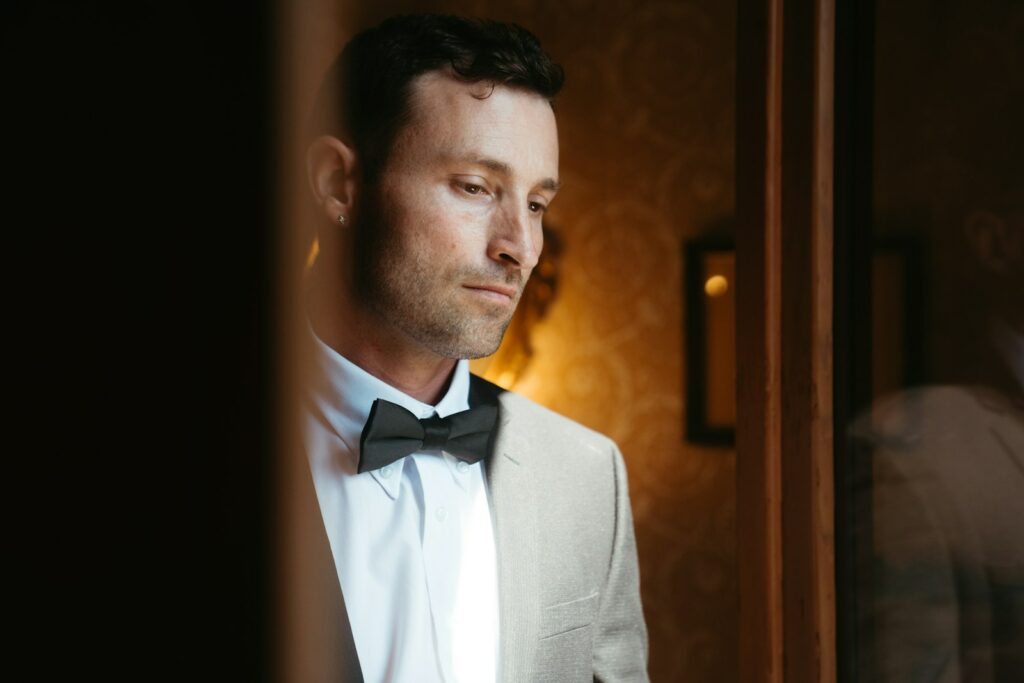 A dapper man ponders.